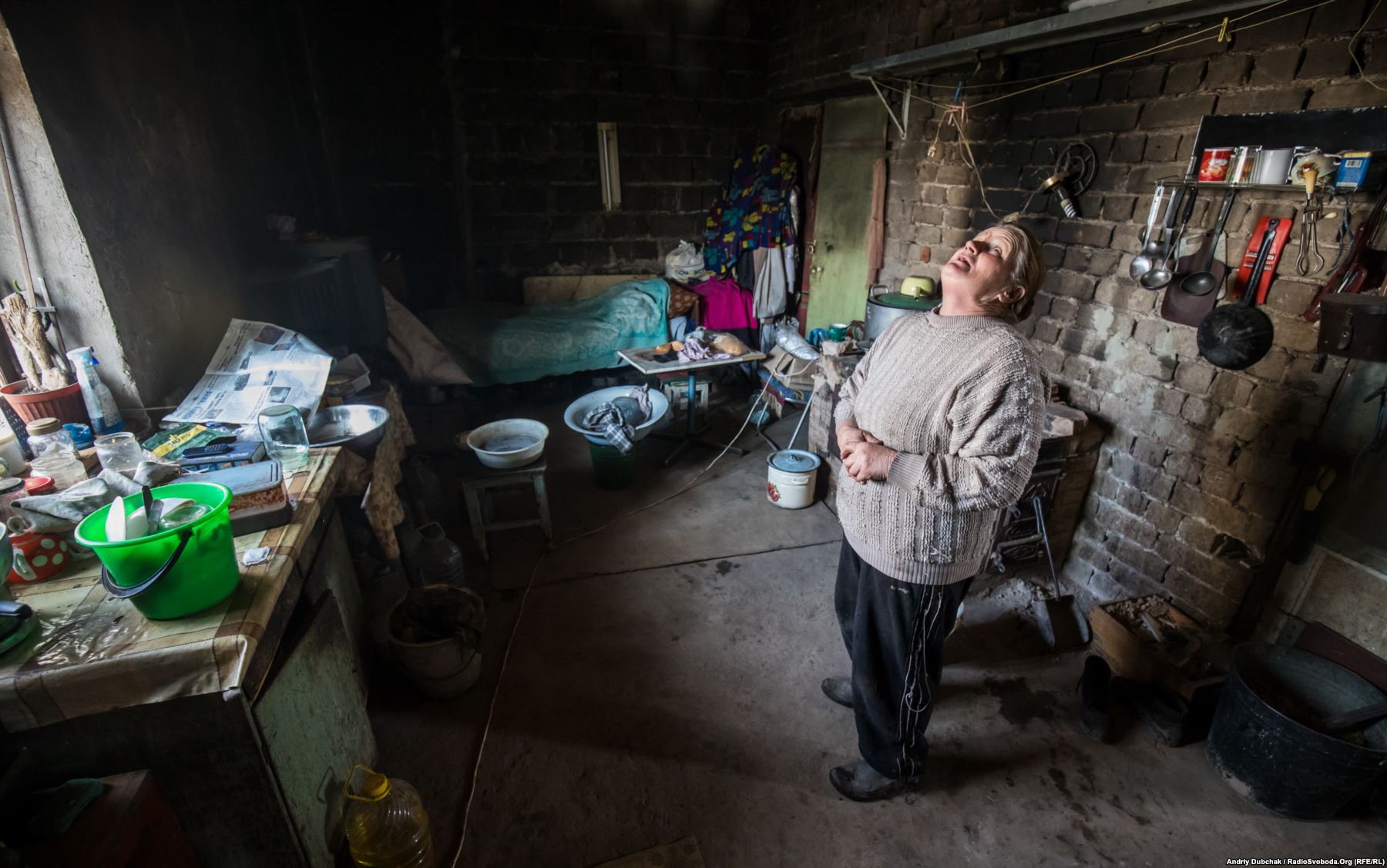 Zoya Kral lost her husband and son during the fighting. She now lives alone in Vodyane, surviving on handouts from the Ukrainian military and the Red Cross. Photo by: Andriy Dubchak