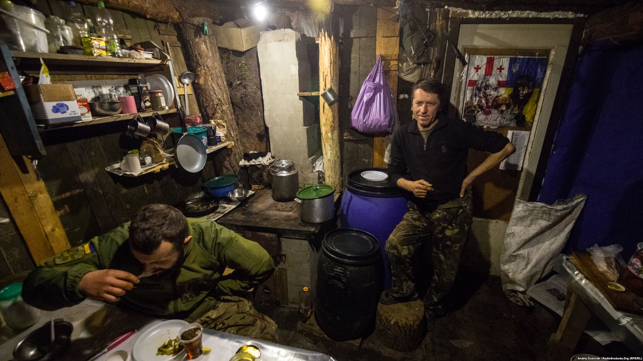 Kitchen- dining room. On the right, Doc, who is both a medic and a cook (photo by ukrainian military photographer Andriy Dubchak)