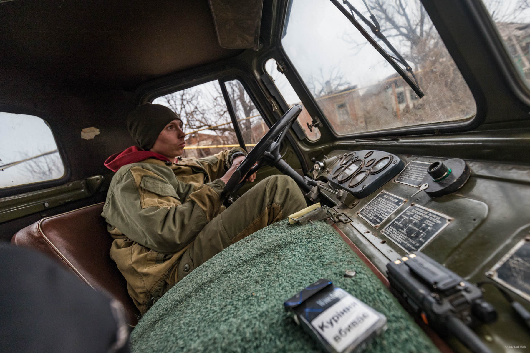 On his "Shishiha,"Driver, Vitaliy, (23 years old, native of Cherkassy region) delivered firewood to one of the front positions. In Shirokine, it was his second rotation. The front driver is a dangerous military profession, since transport is one of the main targets of gunfire, and the enemy shoots through the entrances to the front positions from all types of weapons. The main advice from Vitaly was - never panic! Shirokine, March 2018.