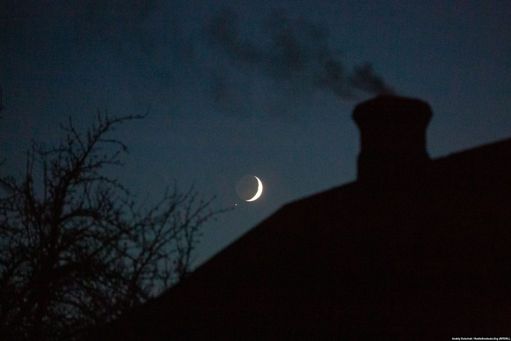 We completed our visit and photo report. Leaving the area, we saw the crescent moon starkly outlined in the dark sky over “grey” Katerynivka. It was quiet… (photographer Andriy Dubchak)