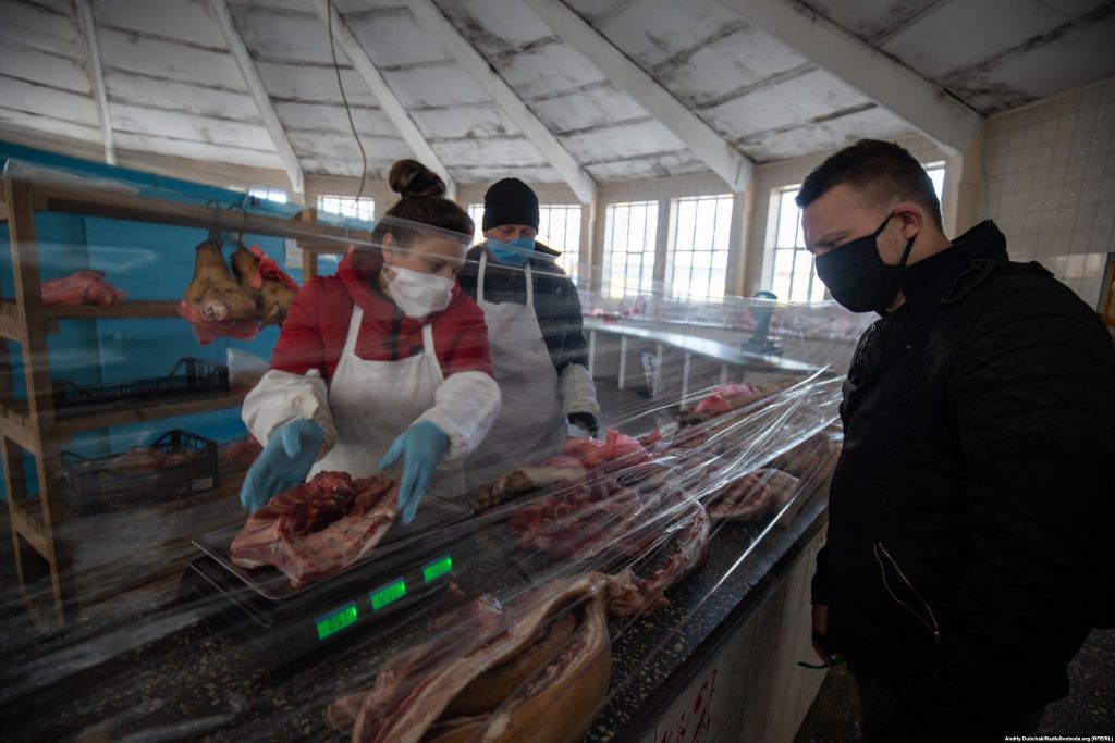 At a butcher's shop, residents of Kalynivka told RFE/RL that the Ukrainian government was providing financial support to some workers until April 26. "What comes next is unknown," one worried resident said.  Photographer Andriy Dubchak / Ukraine